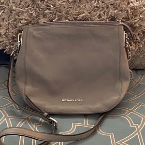 Grey Micheal Kors Crossbody purse.